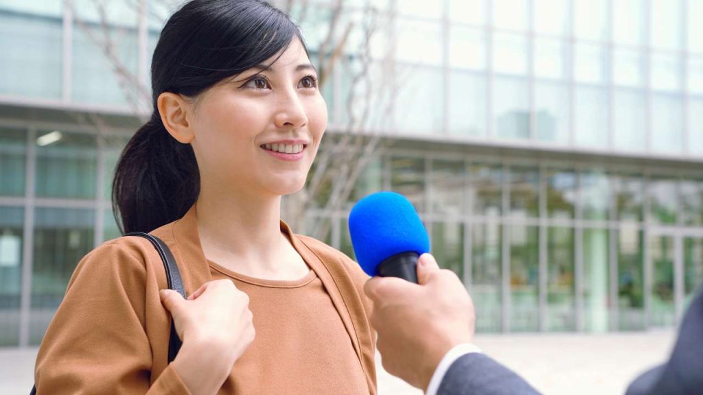 woman being interviewed in japan